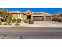 Beautiful single-story home with solar panels and a two-car garage at 18904 W Mercer Ln, Surprise, AZ 85388