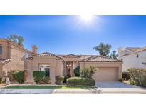 House exterior showcasing Spanish-style architecture and manicured lawn at 1942 W Peninsula Cir, Chandler, AZ 85248