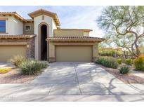 Front view of a two-story townhome with attached two-car garage at 21320 N 56Th St # 2001, Phoenix, AZ 85054