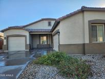 Beige house with two-car garage and landscaping at 2441 W Beverly Rd, Phoenix, AZ 85041