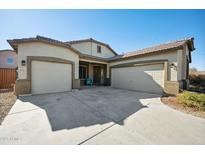 Two-car garage and inviting front porch characterize this beautiful home's exterior at 2441 W Beverly Rd, Phoenix, AZ 85041