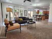 Inviting living room features lots of natural light and neutral decor, perfect for relaxation at 2441 W Beverly Rd, Phoenix, AZ 85041
