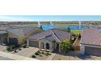 Aerial view of a house near lake with fountains at 24454 N 173Rd Ln, Surprise, AZ 85387