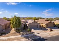 Single-story house with desert landscaping, two-car garage, and mountain views at 2629 E Santa Maria Dr, Casa Grande, AZ 85194