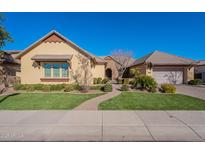 Beautiful single-story home with a landscaped yard and two-car garage at 2952 E Warbler Rd, Gilbert, AZ 85297