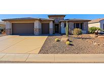 Single-story home with stone accents and desert landscaping at 3020 N 165Th Ave, Goodyear, AZ 85395