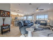 Open living room showcasing kitchen, recessed lighting, and comfortable seating at 3888 E Hazeltine Way, Chandler, AZ 85249