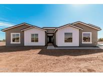 Beautiful single-story home featuring modern farmhouse style and desert landscaping at 17017 W Baker Dr, Surprise, AZ 85387