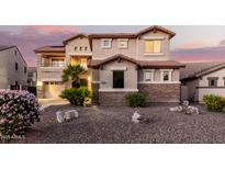 Two-story house with stone accents and landscaping at 2626 E Bear Creek Ln, Phoenix, AZ 85024