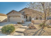 Single-story home with stone accents and landscaped front yard at 6233 W Maya Dr, Phoenix, AZ 85083