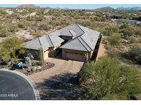 Single-story home with a large backyard and desert landscaping at 6251 E Bramble Berry Ln, Cave Creek, AZ 85331