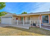 Ranch style home with carport and front patio at 10432 W El Capitan Cir, Sun City, AZ 85351