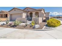 Single-story home with desert landscaping and a two-car garage at 16789 S 181St Ln, Goodyear, AZ 85338