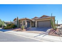 Single-story home with desert landscaping and a two-car garage at 17721 N Canal Dr, Surprise, AZ 85374