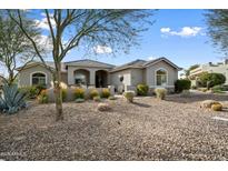 Single-story home with desert landscaping and a large front yard at 19019 E Via Hermosa --, Rio Verde, AZ 85263