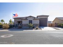 Single-story home with stone accents and a large garage at 2052 N Montclair Ln, Casa Grande, AZ 85122