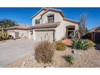 Two-story home with desert landscaping and a two-car garage at 23619 N 21St St, Phoenix, AZ 85024