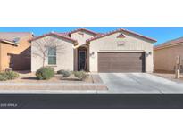 Single-story house with a two-car garage and desert landscaping at 2622 E Marcos Dr, Casa Grande, AZ 85194