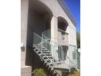 Exterior view of building entrance with stairs and metal railing at 29606 N Tatum Blvd # 216, Cave Creek, AZ 85331