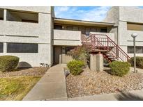 Updated condo building with walkway and landscaping at 3301 E Earll Dr # 102, Phoenix, AZ 85018