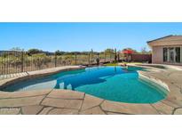 Inviting kidney-shaped pool with flagstone decking at 40610 N Bradon Ct, Phoenix, AZ 85086