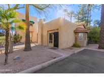 Cute stucco home with a charming front entrance and mature landscaping at 4540 N 44Th St # 69, Phoenix, AZ 85018