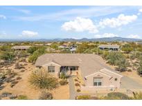 Aerial view of single-story house with desert landscaping and mountain views at 5950 E Lowden Ct, Cave Creek, AZ 85331