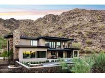 Stunning modern home with stone accents, nestled in the mountains at 8200 N Charles Dr, Paradise Valley, AZ 85253