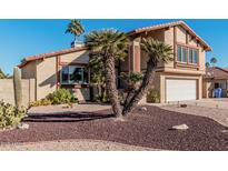 Two-story house with a large garage and desert landscaping at 1918 E Hearn Rd, Phoenix, AZ 85022