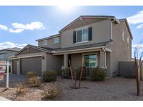 Two-story house with brown garage doors and landscaping at 2071 E Piedmont Pl, Casa Grande, AZ 85122