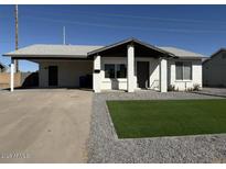 Cute single story home with carport and artificial turf at 4062 W Camino Acequia St, Phoenix, AZ 85051