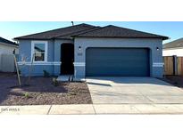 Charming single-story home featuring a two-car garage and low maintenance landscaping at 5501 E Rock Bush Ln, San Tan Valley, AZ 85140