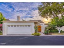 Single-story home with attached garage and landscaped front yard at 7028 N Barbados Pl, Phoenix, AZ 85021