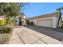 Single-story home with a two-car garage and landscaped front yard at 7705 E Doubletree Ranch Rd # 55, Scottsdale, AZ 85258