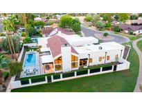 Modern home with pool, patio and large fenced yard in a verdant community at 8255 E Morgan Trl, Scottsdale, AZ 85258