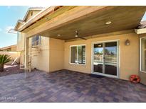 Charming covered patio with spiral staircase and views of the backyard pool area at 11825 S 46Th St, Phoenix, AZ 85044