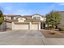 Two-story house with a three-car garage and basketball hoop at 17948 W Diana Ave, Waddell, AZ 85355