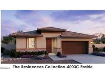 Single-story home with two-car garage and desert landscaping at 22653 W Irma Ln, Surprise, AZ 85387