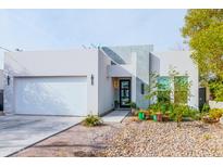 Modern house exterior with a two-car garage and nicely landscaped front yard at 2826 N 28Th Pl, Phoenix, AZ 85008