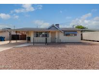 Ranch style home with carport and gravel landscaping at 1416 S Lawther Dr, Apache Junction, AZ 85120