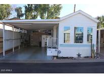 Mobile home with carport and storage shed at 4220 E Main St # F-45, Mesa, AZ 85205