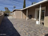 Spacious back patio with tile flooring and mountain views at 469 W Newmont St, Superior, AZ 85173