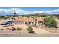 Single-story home with desert landscaping and mountain views at 4832 W Saguaro Park Ln, Glendale, AZ 85310