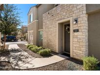 Inviting exterior with stone accents and landscaped walkway at 730 E Zesta Ln # 101, Gilbert, AZ 85297