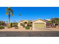 Single-story house with desert landscaping and a two-car garage at 14790 W Merrell St, Goodyear, AZ 85395