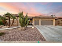 Desert landscaping enhances curb appeal of this inviting home with a two-car garage at 16244 W Cheery Lynn Rd, Goodyear, AZ 85395