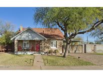 Charming craftsman home with red door and mature tree at 2501 N Edgemere St, Phoenix, AZ 85006