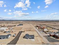Expansive desert property featuring horse facilities and ample space for outdoor living at 28813 N 201St Ave, Wittmann, AZ 85361