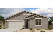 Single-story home with neutral exterior and two-car garage at 46941 W Old Timer Rd, Maricopa, AZ 85139