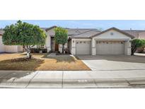 Single-story house with two-car garage and a mature tree in the front yard at 741 W Cherrywood Dr, Chandler, AZ 85248